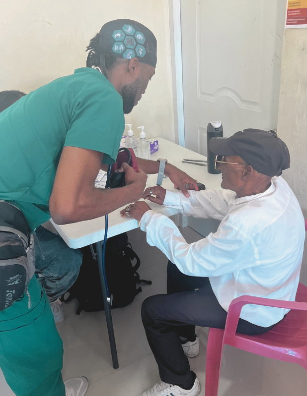 premed student intern working with a patient during abroad internship premed student intern working with a patient during abroad medical research internship