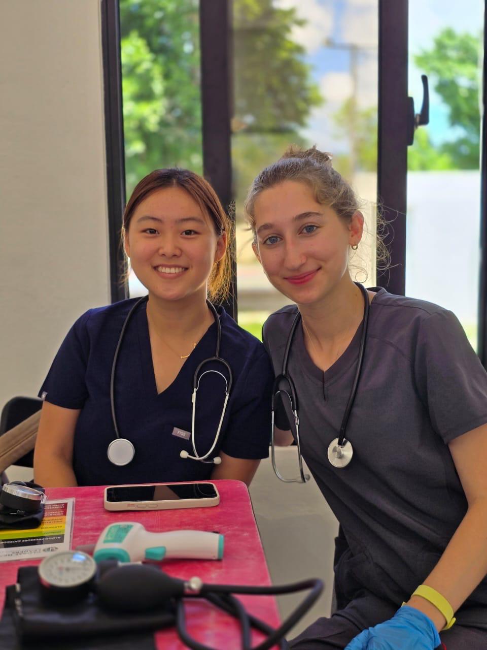 Two medical students participating in Global Health Leaders’ 1:1 Medical Research Mentorship program, receiving Harvard-affiliated research guidance in a hands-on learning environment.